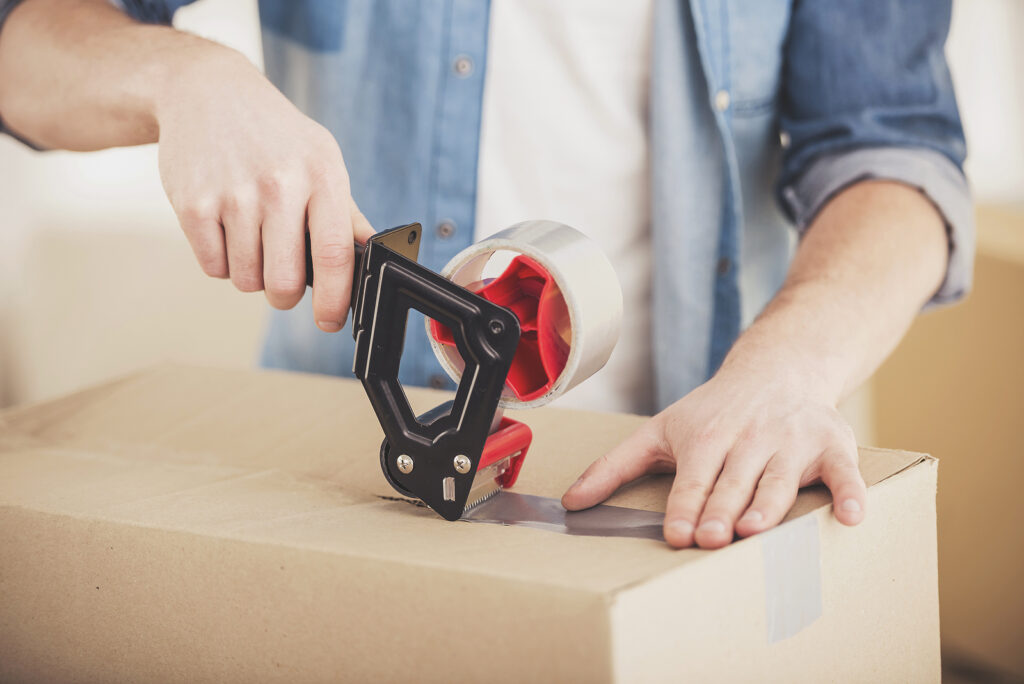 House removals - Man Packing Box